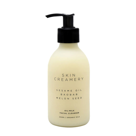 Skin Creamery oil to milk cleanser and make up remover.  White yellow liquid in glass bottle with black pump 